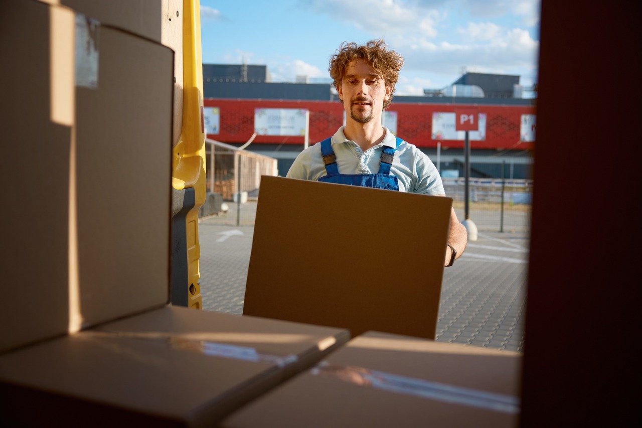 Delivery man helping with unpacking